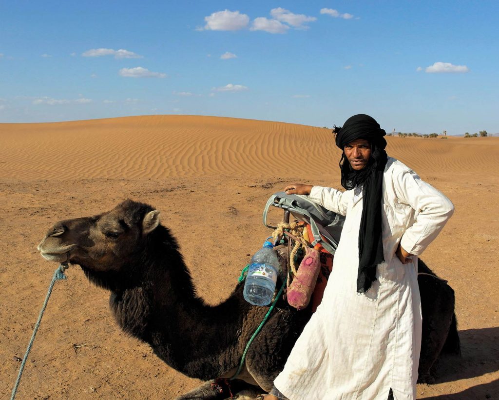 A Berber nomad with his camel